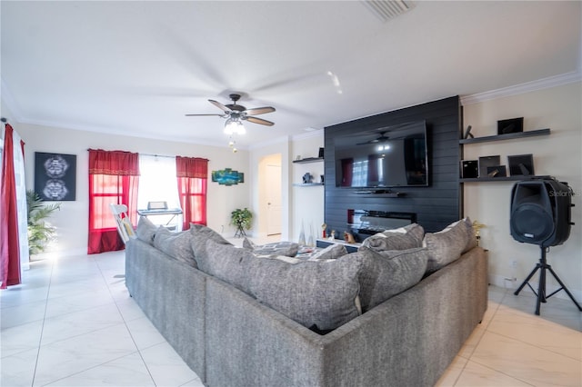 living room with ceiling fan and ornamental molding