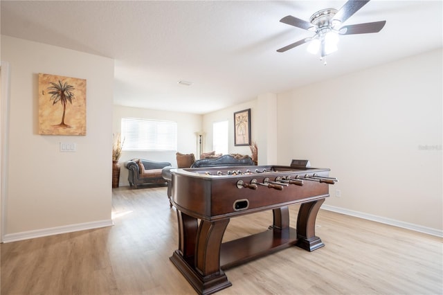 rec room featuring ceiling fan and light hardwood / wood-style flooring