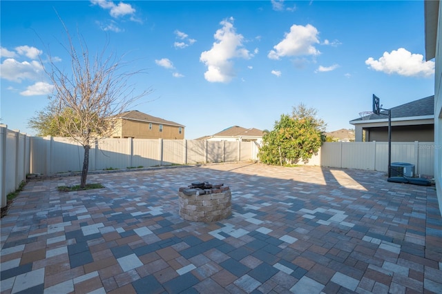 view of patio with a fire pit