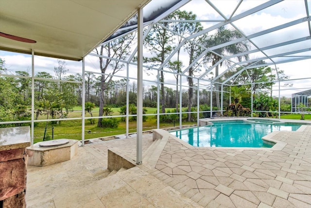 view of pool featuring a lanai, a patio, and an in ground hot tub