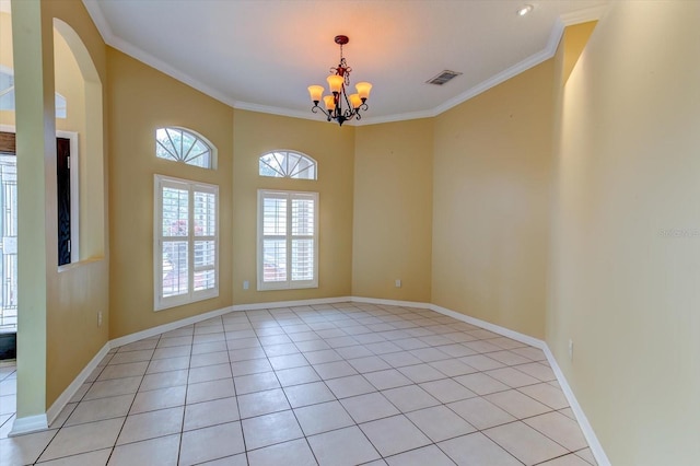 spare room with a notable chandelier, crown molding, and light tile patterned flooring