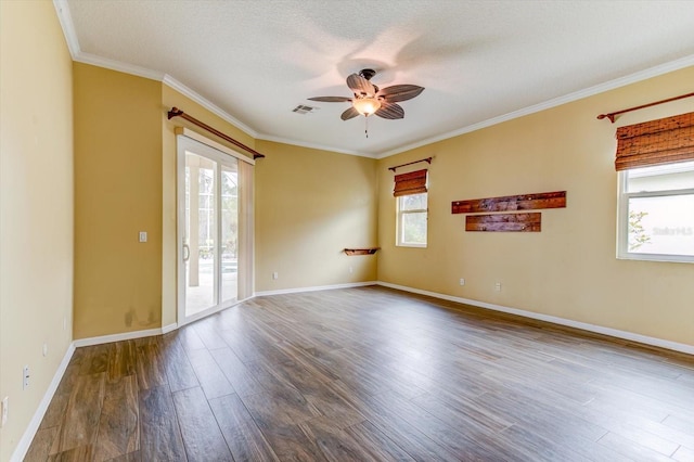 empty room with ceiling fan, crown molding, wood-type flooring, and a textured ceiling