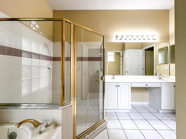 bathroom with tile patterned flooring, vanity, and separate shower and tub