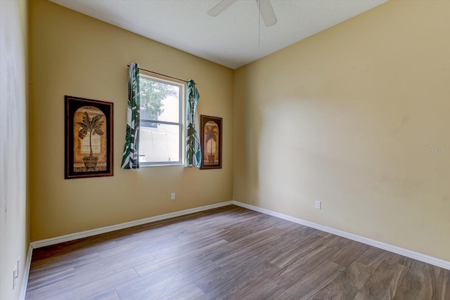 spare room featuring ceiling fan and light wood-type flooring