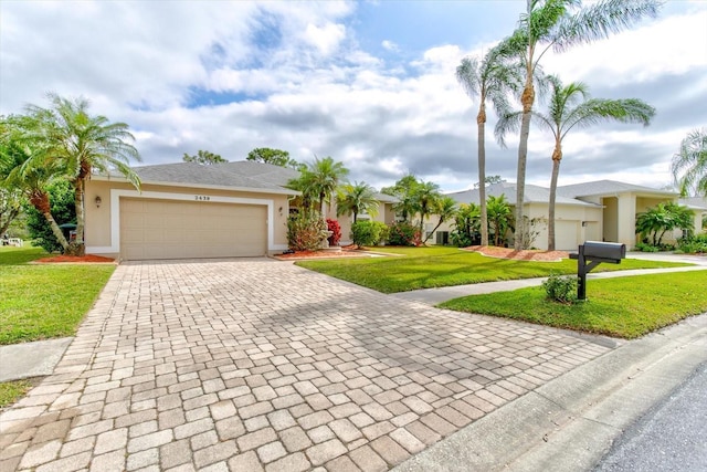 single story home with a garage and a front yard