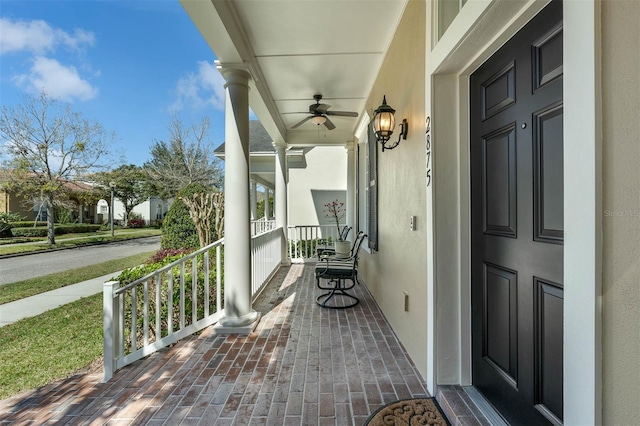 exterior space featuring a porch and stucco siding