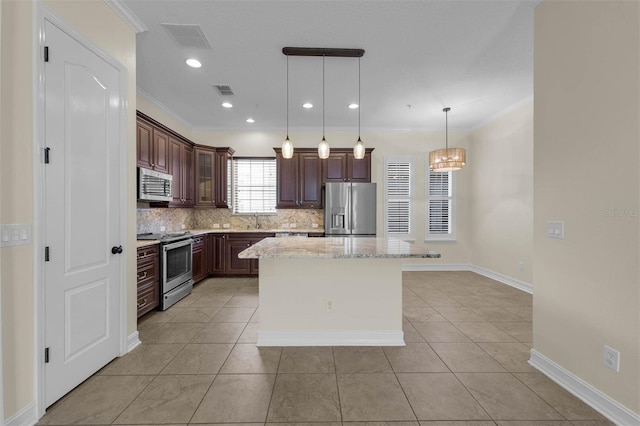 kitchen with tasteful backsplash, visible vents, ornamental molding, stainless steel appliances, and a sink