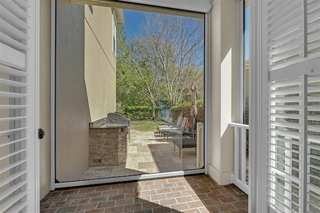 doorway with brick floor