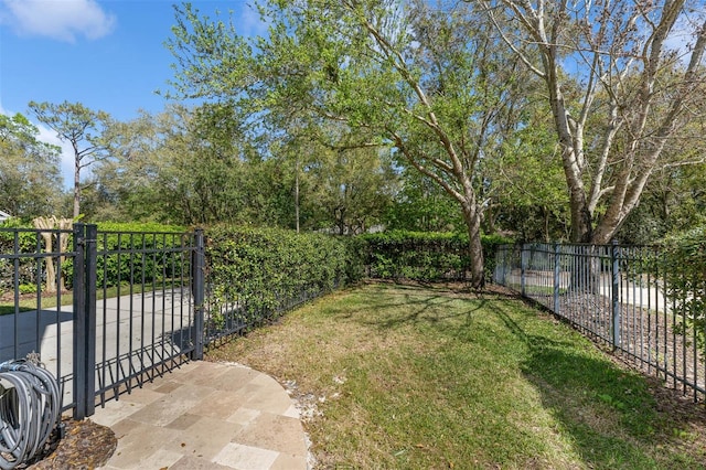 view of yard featuring fence private yard and a gate