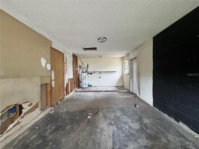115 S Lake Pleasant Rd, Apopka, FL 32703 - corridor with water heater and a textured ceiling