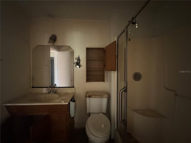 115 S Lake Pleasant Rd, Apopka, FL 32703 - bathroom with a shower with door, vanity, and toilet