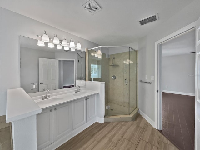 662 Lake Dr, Altamonte Springs, FL 32701 - bathroom featuring a stall shower, visible vents, and a sink