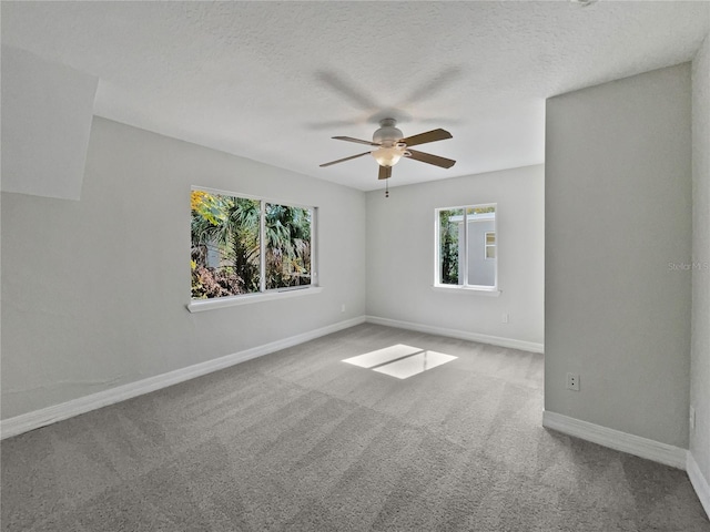 662 Lake Dr, Altamonte Springs, FL 32701 - carpeted spare room with a ceiling fan, a textured ceiling, and baseboards