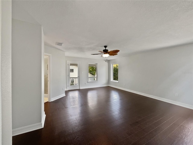 662 Lake Dr, Altamonte Springs, FL 32701 - spare room featuring dark wood-style flooring, visible vents, ceiling fan, a textured ceiling, and baseboards