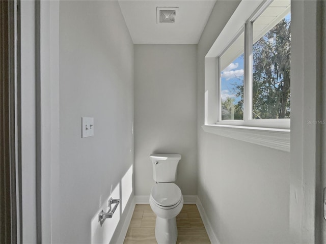 662 Lake Dr, Altamonte Springs, FL 32701 - bathroom with toilet, visible vents, baseboards, and wood finished floors