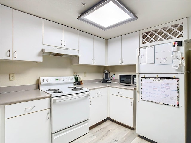 kitchen with white cabinetry, white appliances, and light hardwood / wood-style floors