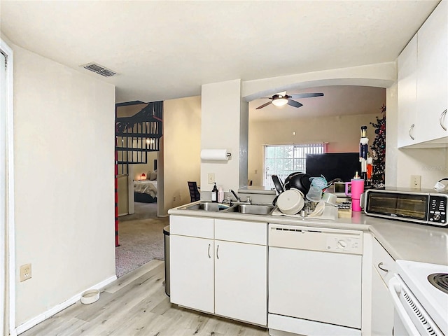 kitchen featuring sink, light wood-type flooring, white cabinets, ceiling fan, and white appliances