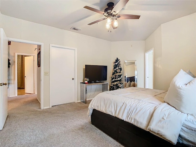 carpeted bedroom with ceiling fan