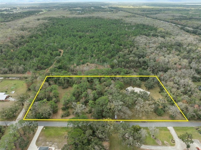 bird's eye view featuring a view of trees