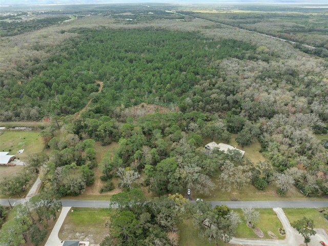 aerial view featuring a forest view