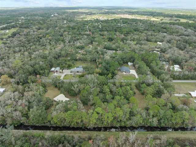 aerial view featuring a wooded view