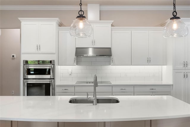 kitchen with double oven, range hood, pendant lighting, and white cabinets