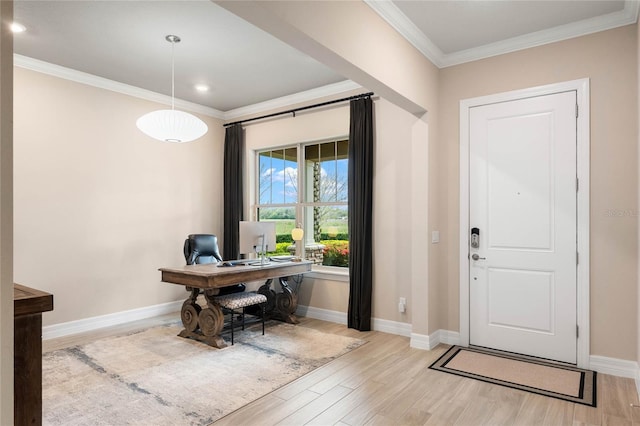 entryway featuring ornamental molding, light wood-style floors, and baseboards