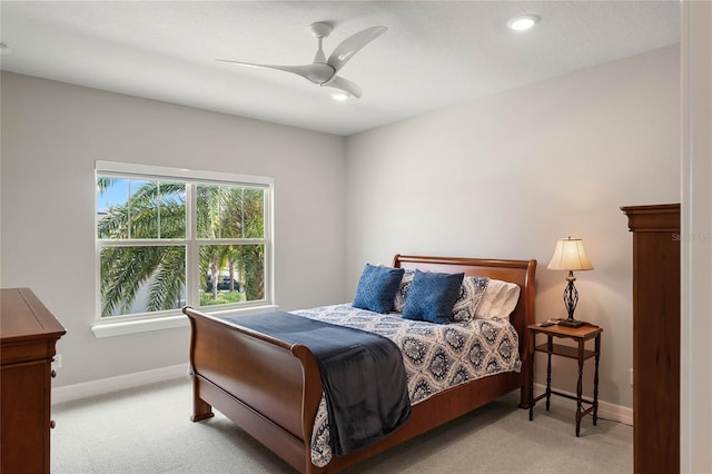 bedroom featuring baseboards, a ceiling fan, recessed lighting, and light carpet