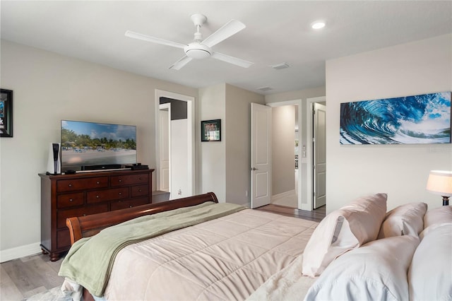 bedroom with light wood-style flooring, baseboards, a ceiling fan, and recessed lighting