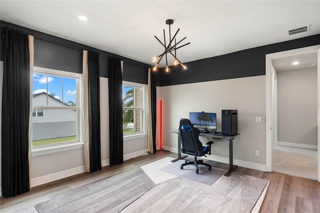 office with recessed lighting, light wood-style floors, baseboards, a notable chandelier, and visible vents