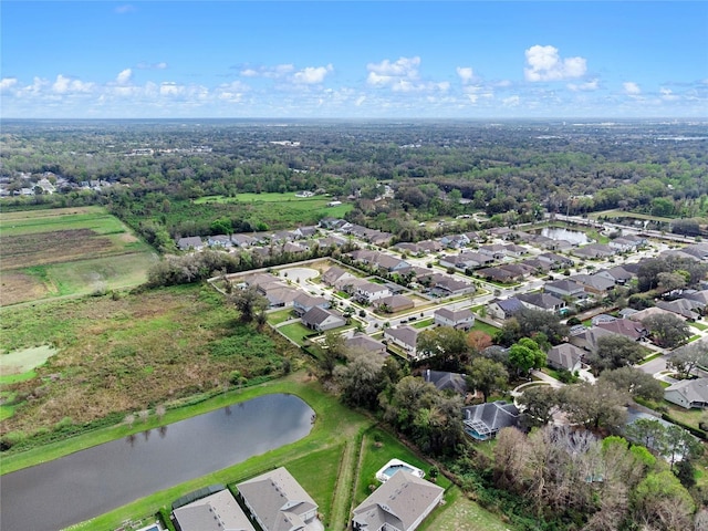 aerial view with a residential view and a water view