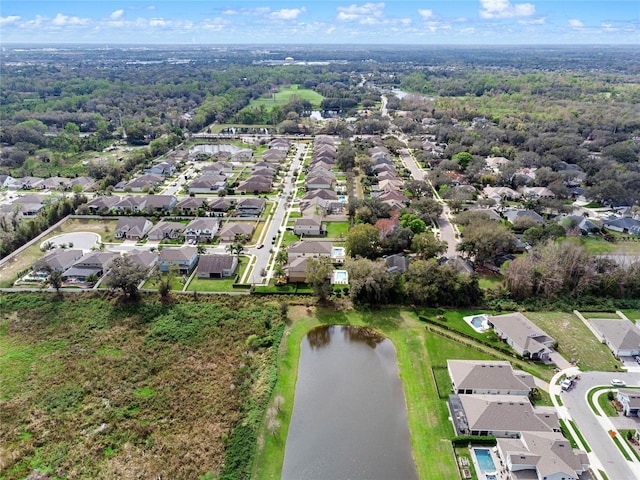 birds eye view of property with a residential view and a water view