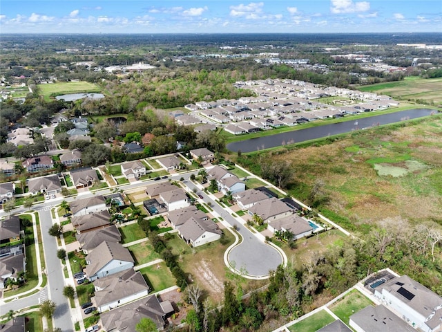 bird's eye view featuring a residential view and a water view