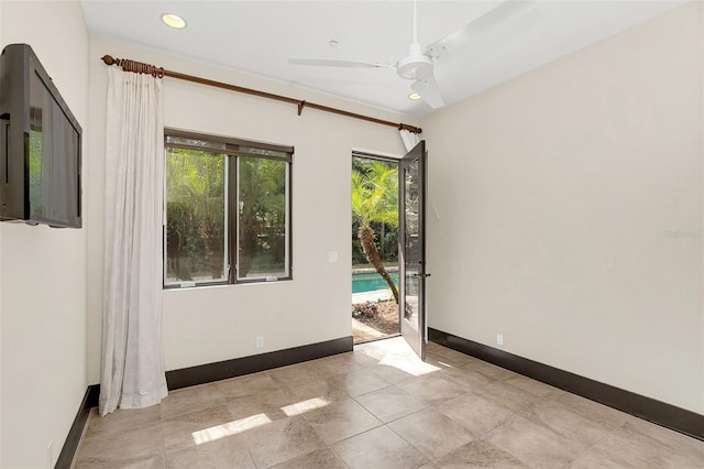 empty room featuring baseboards, a ceiling fan, and recessed lighting