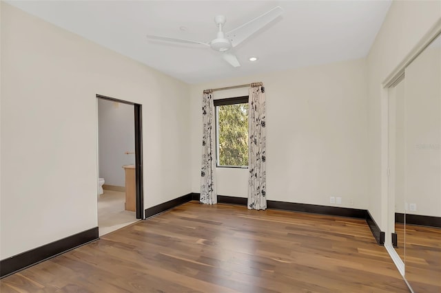 empty room with recessed lighting, ceiling fan, baseboards, and wood finished floors