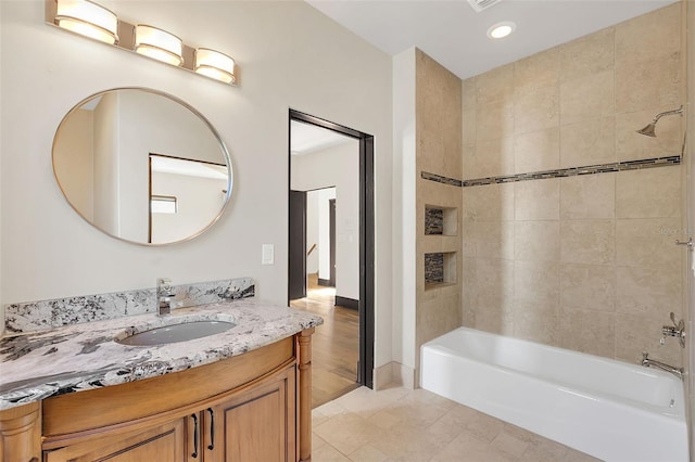 bathroom with recessed lighting, bathtub / shower combination, tile patterned flooring, and vanity