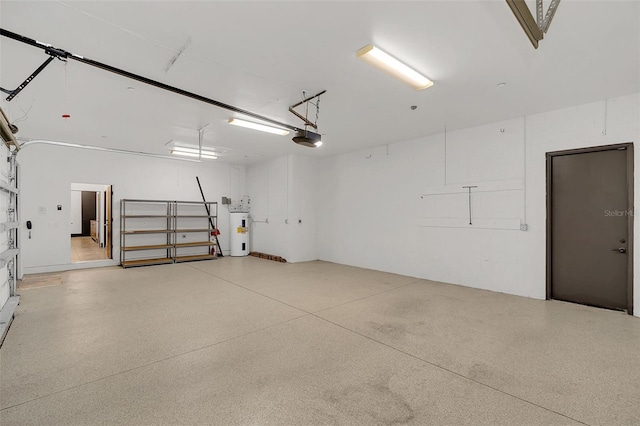 garage with water heater and a garage door opener