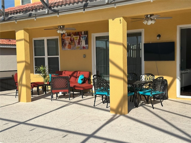 view of patio / terrace featuring ceiling fan and outdoor dining space