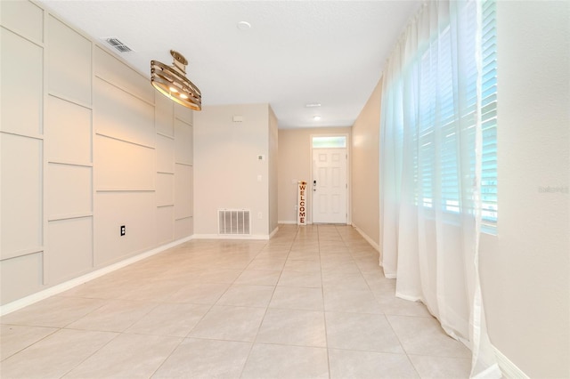 interior space featuring light tile patterned flooring and a wealth of natural light