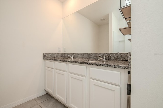 bathroom with tile patterned flooring and vanity