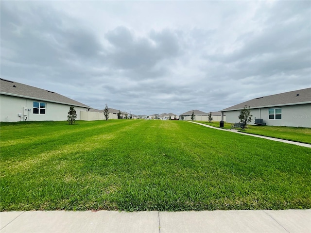 view of yard featuring central AC unit