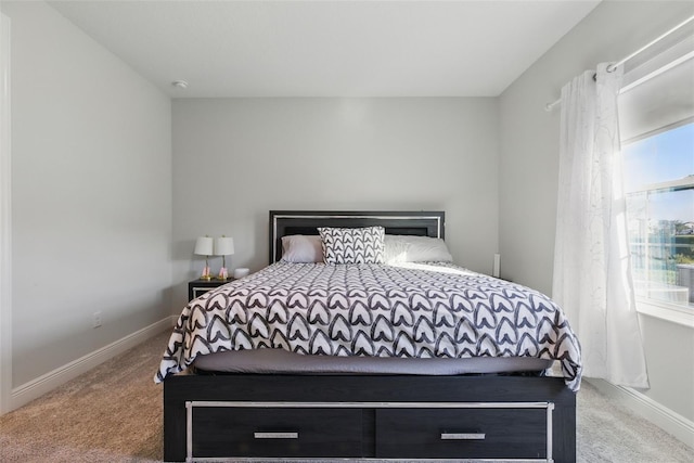 carpeted bedroom with baseboards