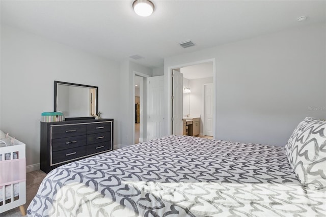 bedroom featuring carpet and visible vents