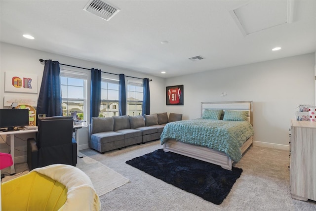 carpeted bedroom with baseboards, recessed lighting, visible vents, and attic access