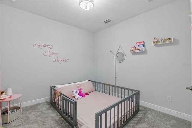 bedroom with baseboards, visible vents, and carpet flooring