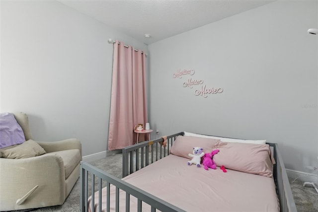 bedroom featuring carpet floors and baseboards