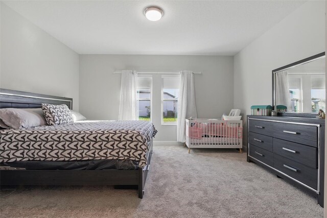 bedroom featuring light colored carpet