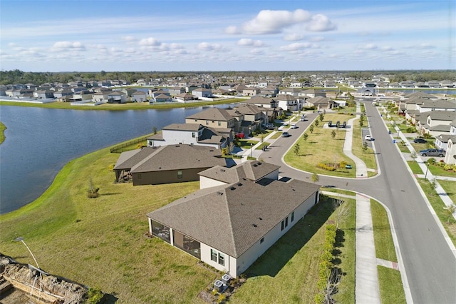 aerial view featuring a water view and a residential view