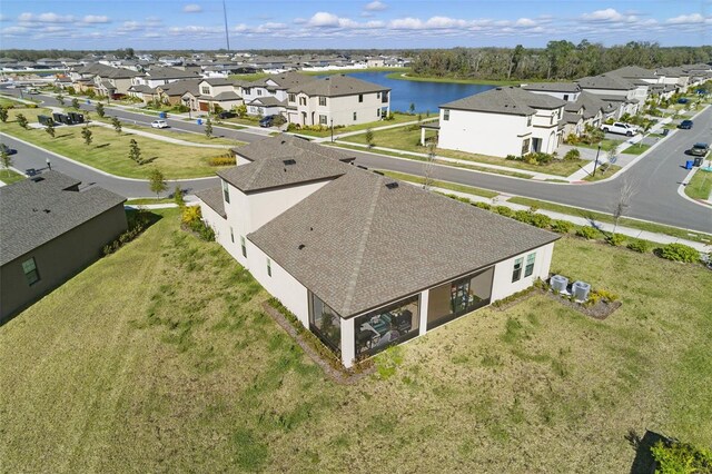 bird's eye view with a water view and a residential view