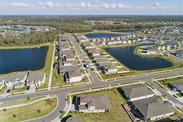 birds eye view of property with a residential view and a water view